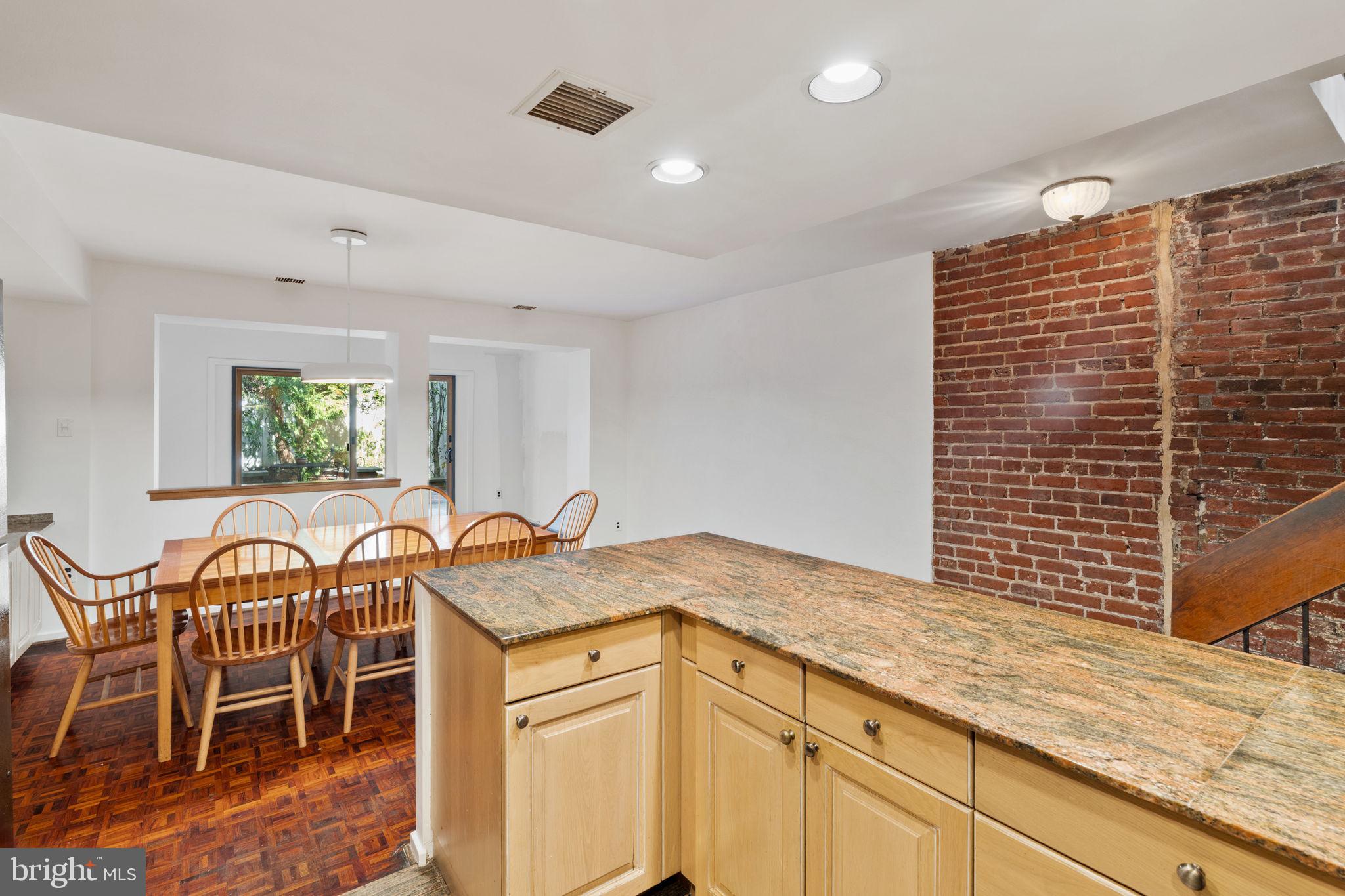 233 Monroe Street Philadelphia, PA 19147 - Photo 11 of 51 a kitchen with a sink and chairs