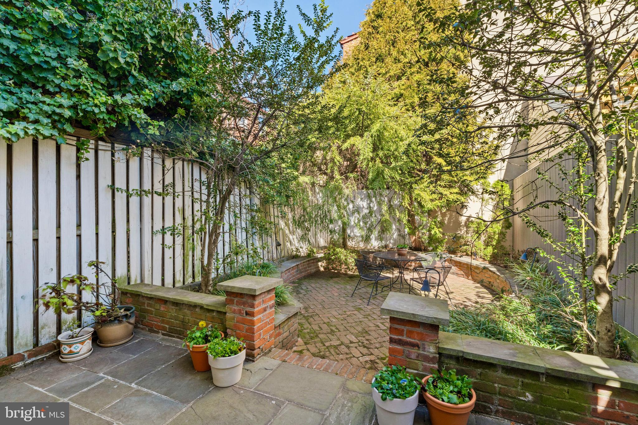 233 Monroe Street Philadelphia, PA 19147 - Photo 15 of 51 a backyard of a house with table and chairs
