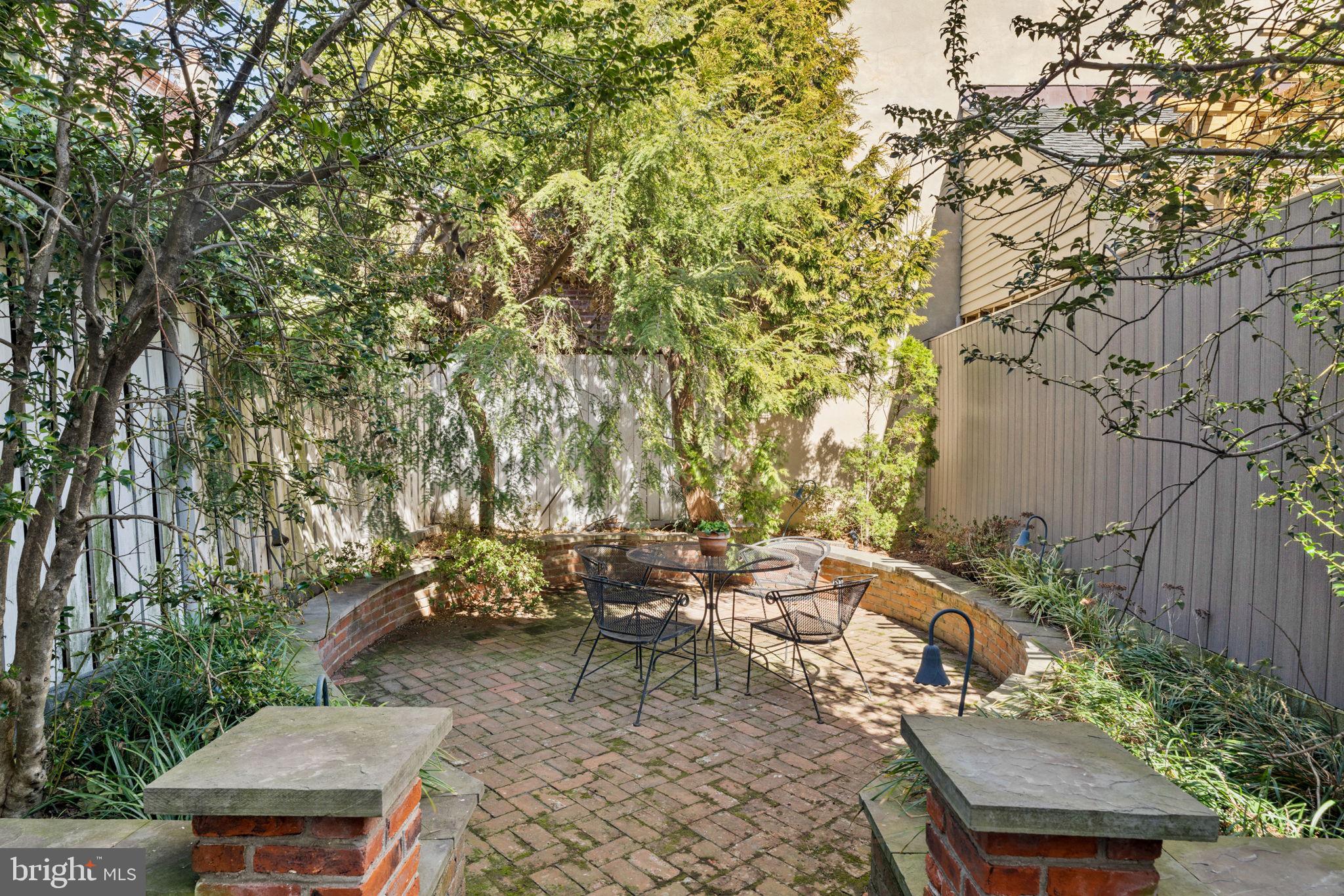 233 Monroe Street Philadelphia, PA 19147 - Photo 16 of 51 a backyard of a house with table and chairs