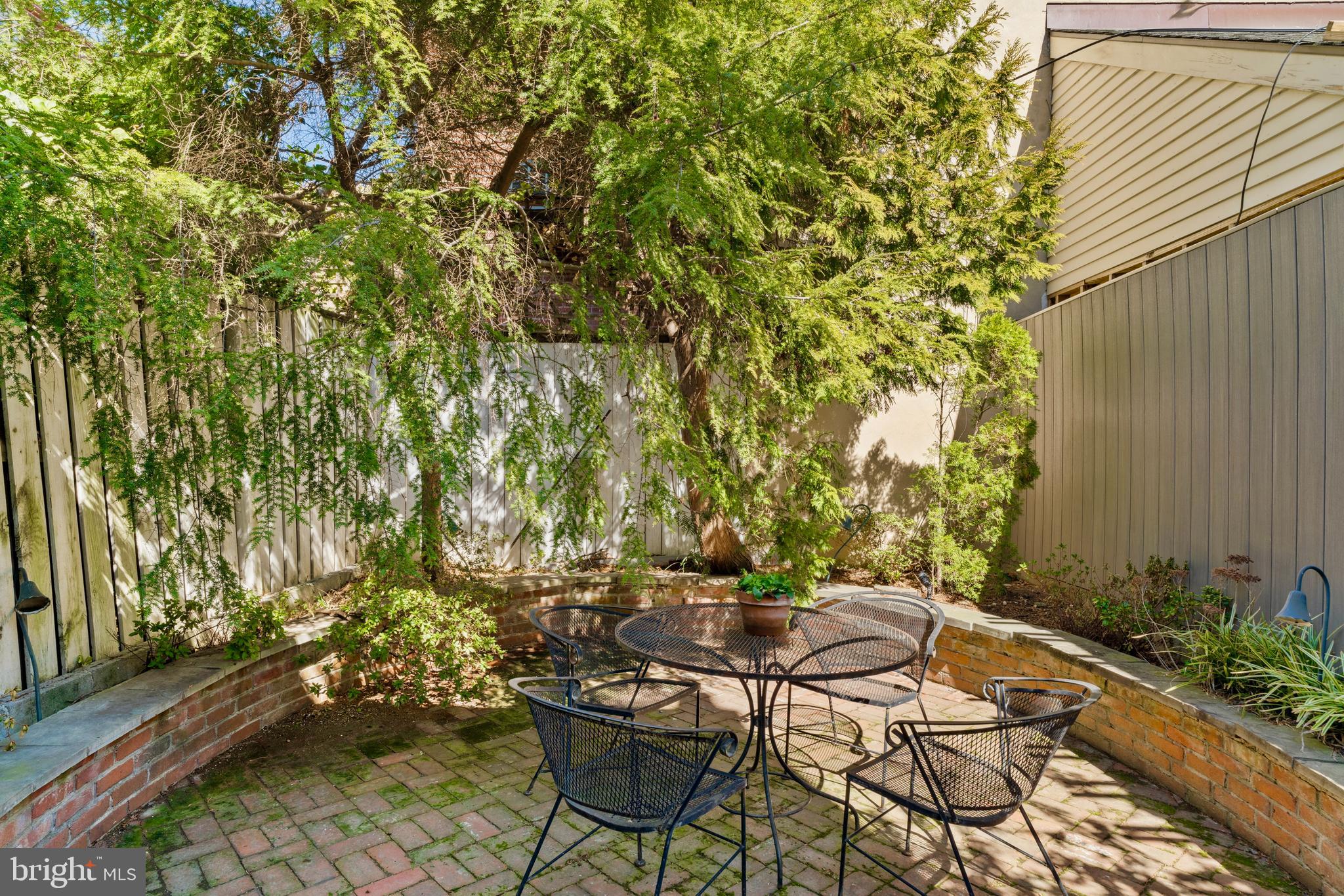 233 Monroe Street Philadelphia, PA 19147 - Photo 17 of 51 a patio with table and chairs and potted plants