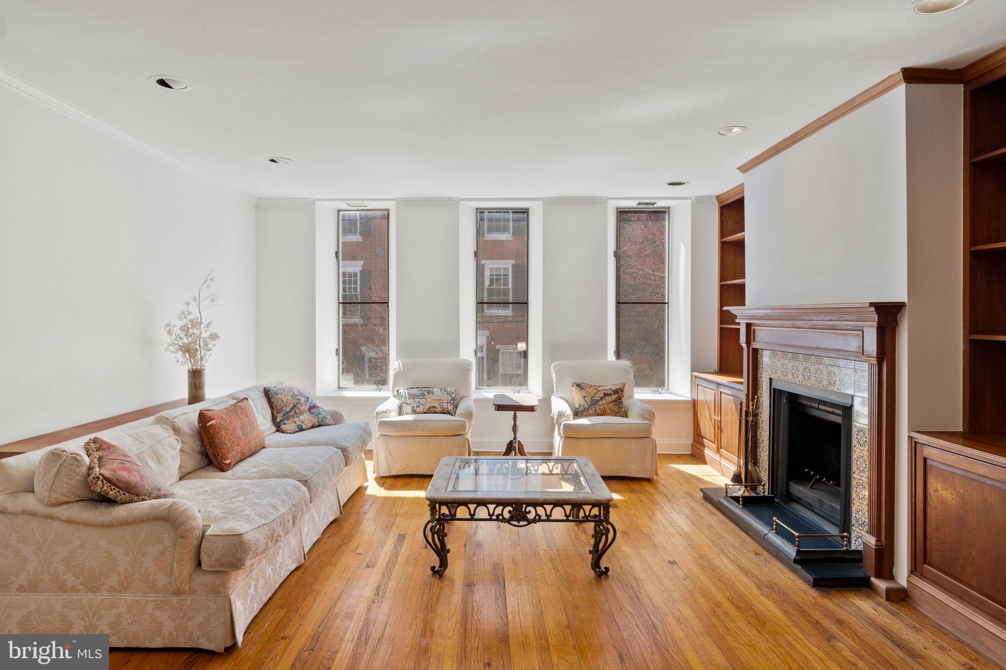 233 Monroe Street Philadelphia, PA 19147 - Photo 20 of 51 a living room with furniture and a fireplace