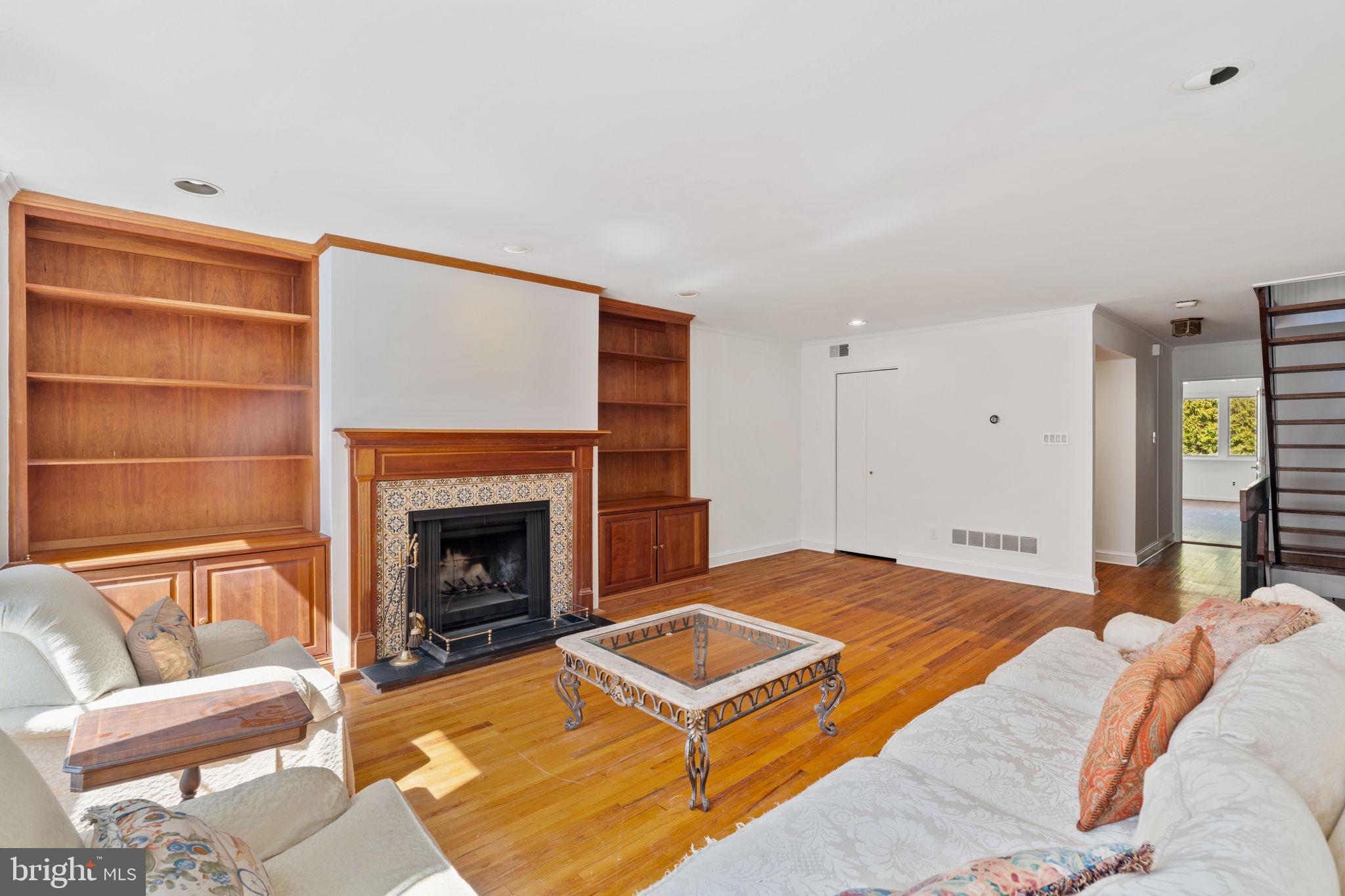 233 Monroe Street Philadelphia, PA 19147 - Photo 22 of 51 a bedroom with a bed a fireplace and a couch