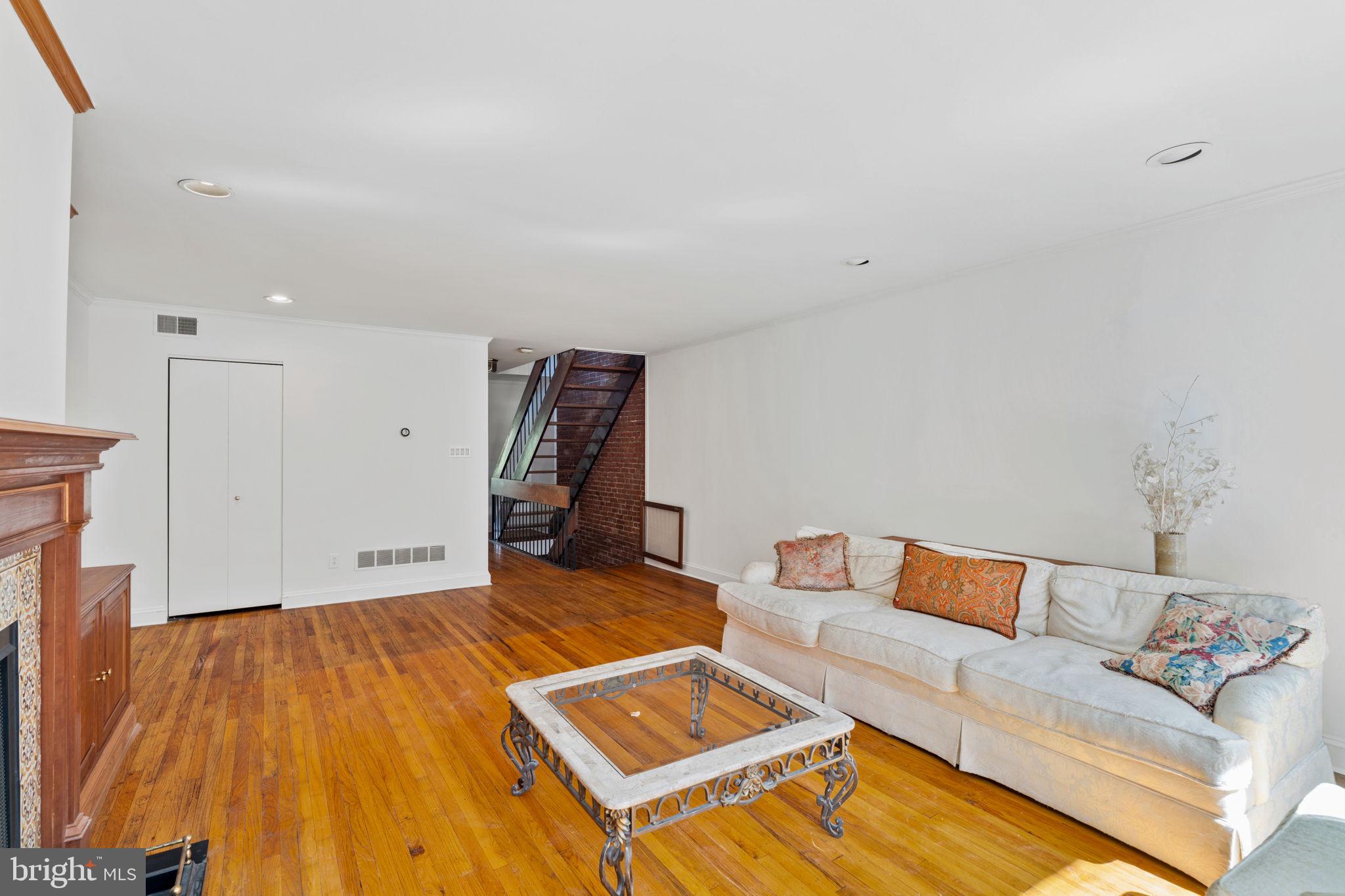233 Monroe Street Philadelphia, PA 19147 - Photo 23 of 51 a living room with a couch and a coffee table