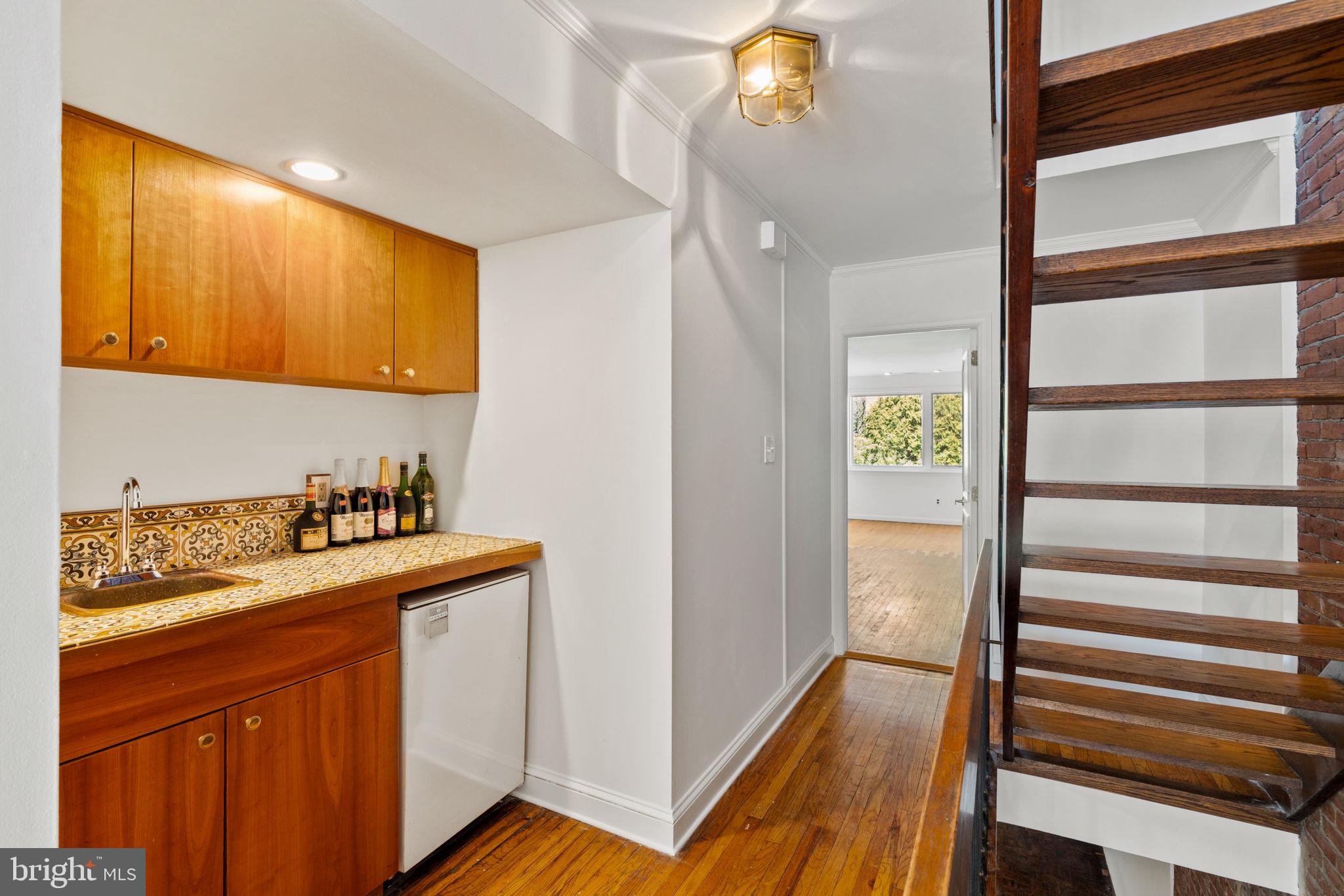 233 Monroe Street Philadelphia, PA 19147 - Photo 25 of 51 a kitchen with a sink and a refrigerator