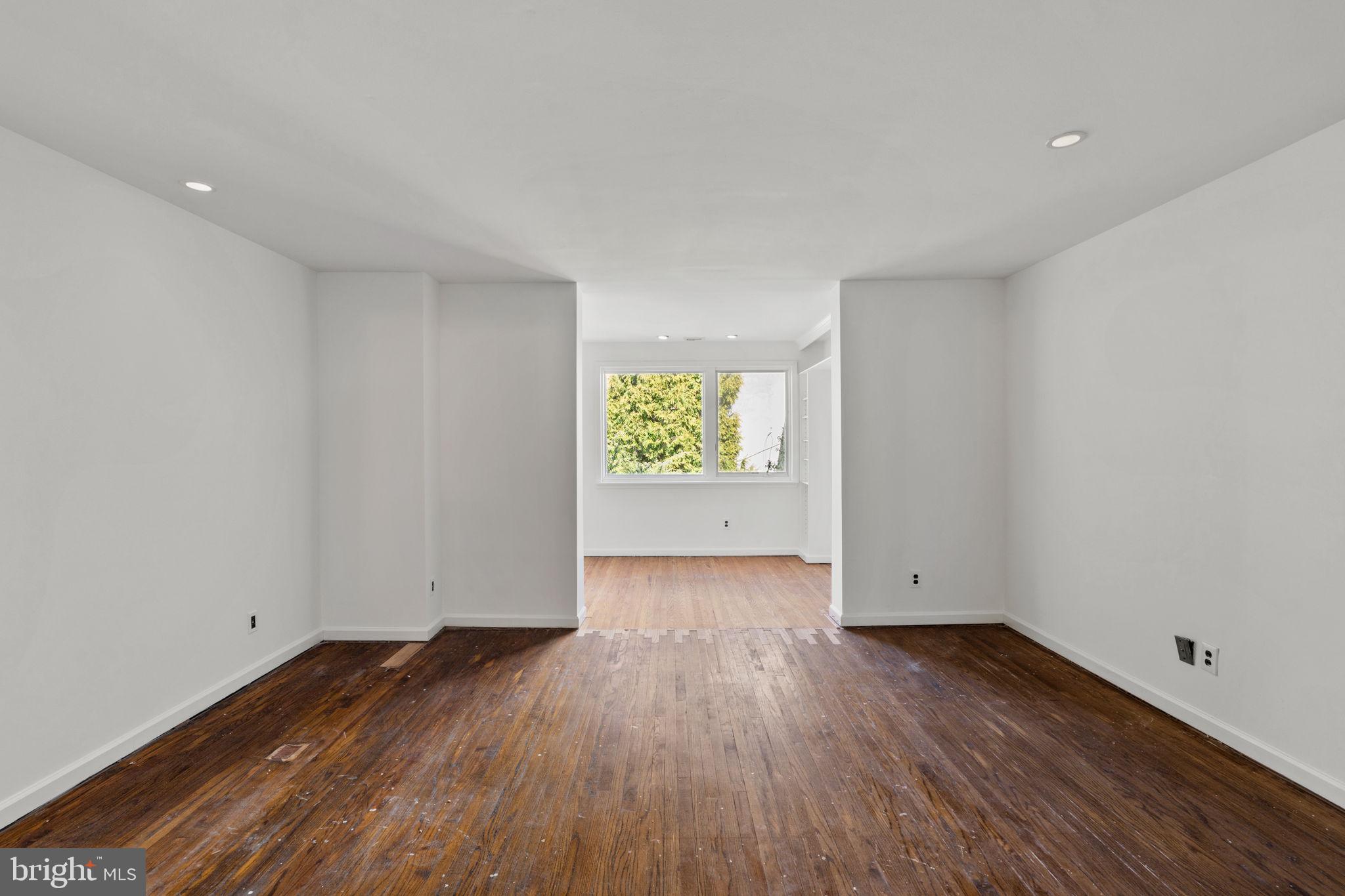 233 Monroe Street Philadelphia, PA 19147 - Photo 27 of 51 an empty room with wooden floor and windows