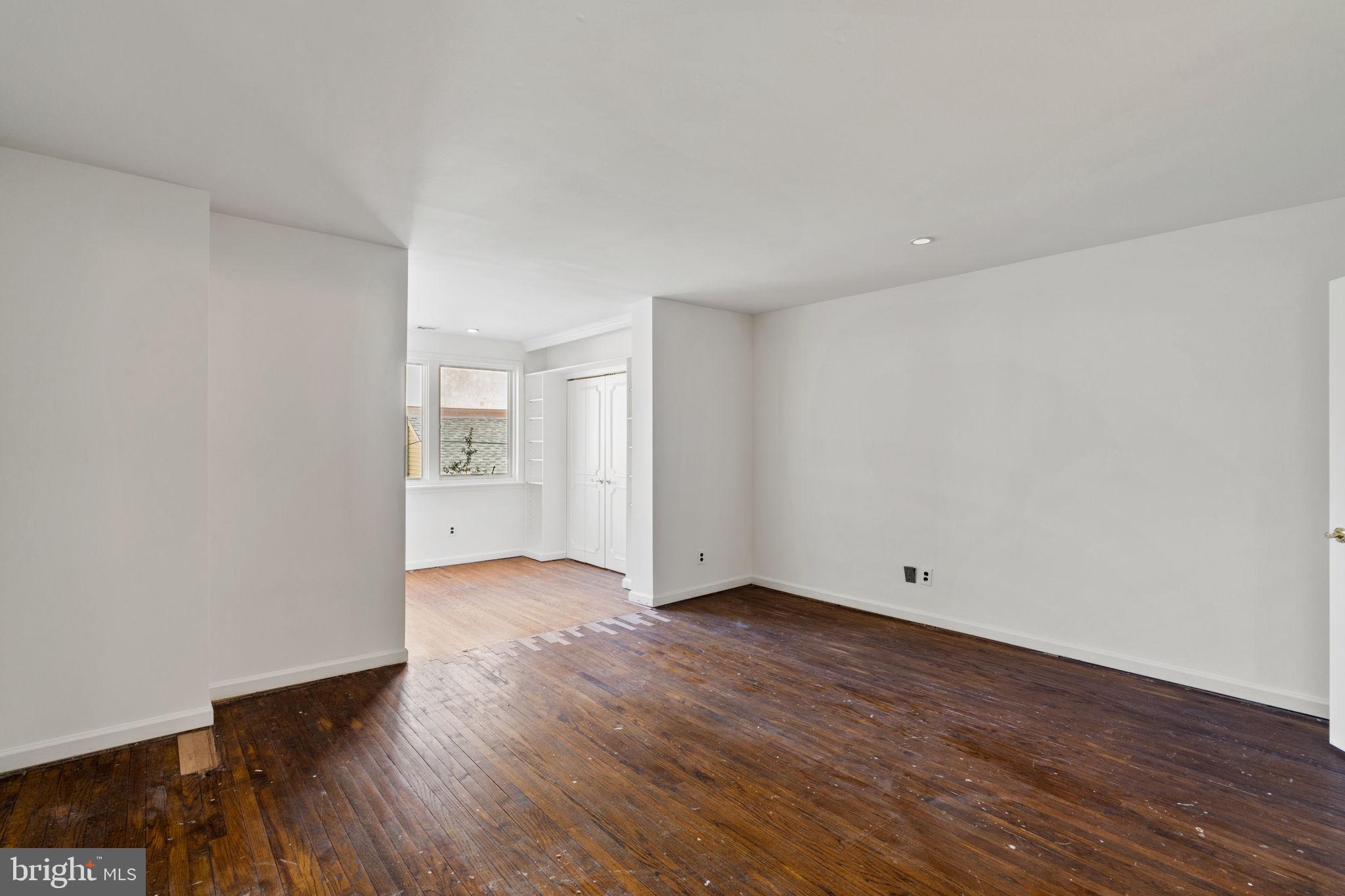 233 Monroe Street Philadelphia, PA 19147 - Photo 28 of 51 a view of an empty room with wooden floor and windows