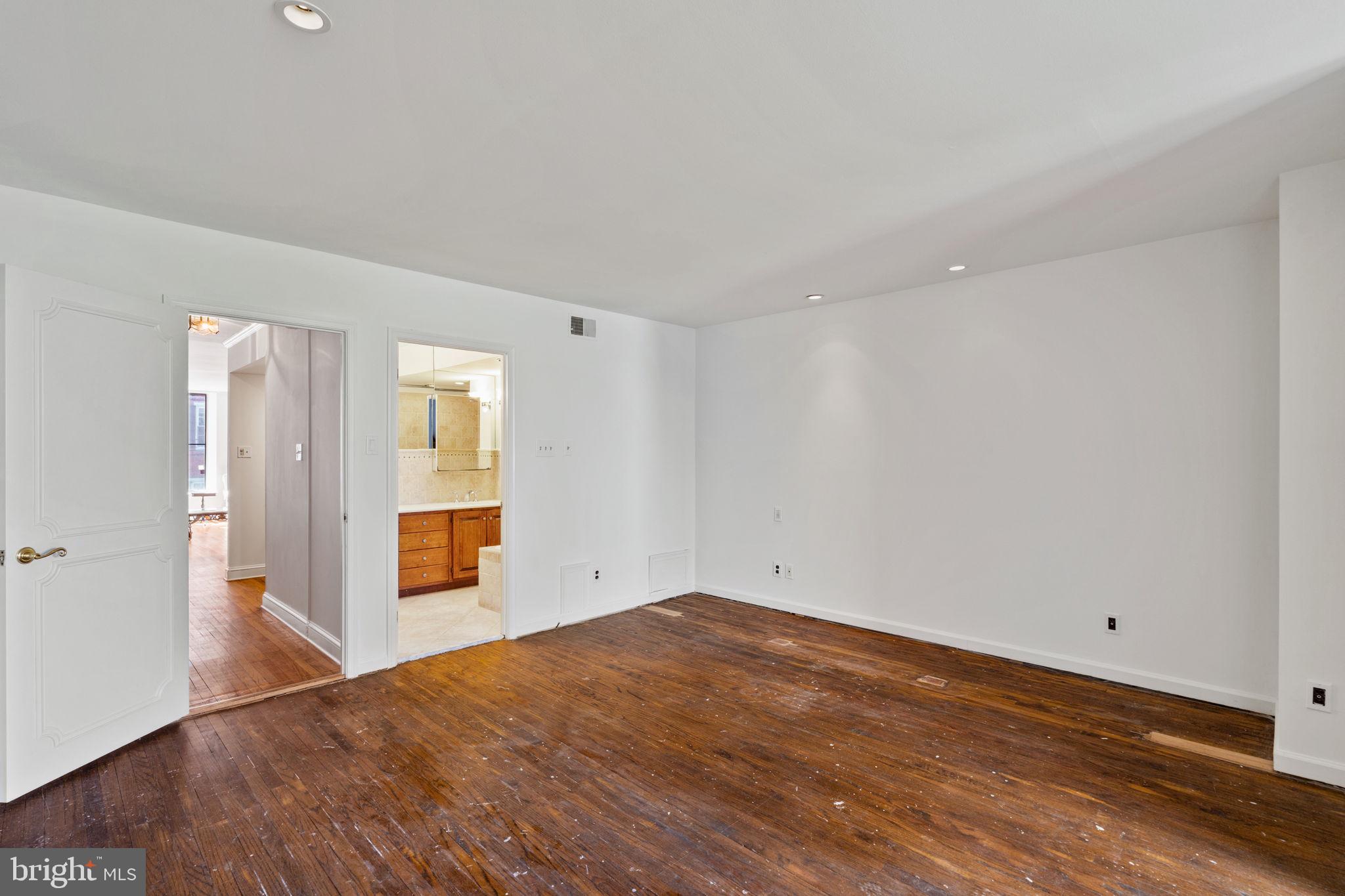 233 Monroe Street Philadelphia, PA 19147 - Photo 30 of 51 a view of an empty room with wooden floor and a window
