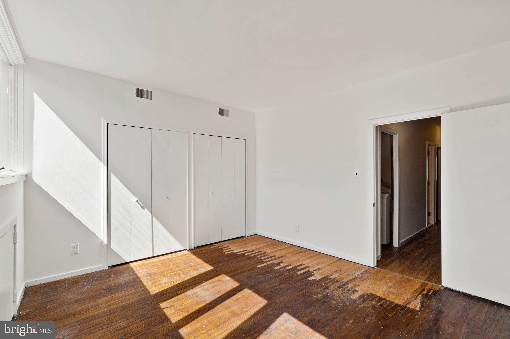 233 Monroe Street Philadelphia, PA 19147 - Photo 35 of 51 a view of a room with wooden floor and stairs