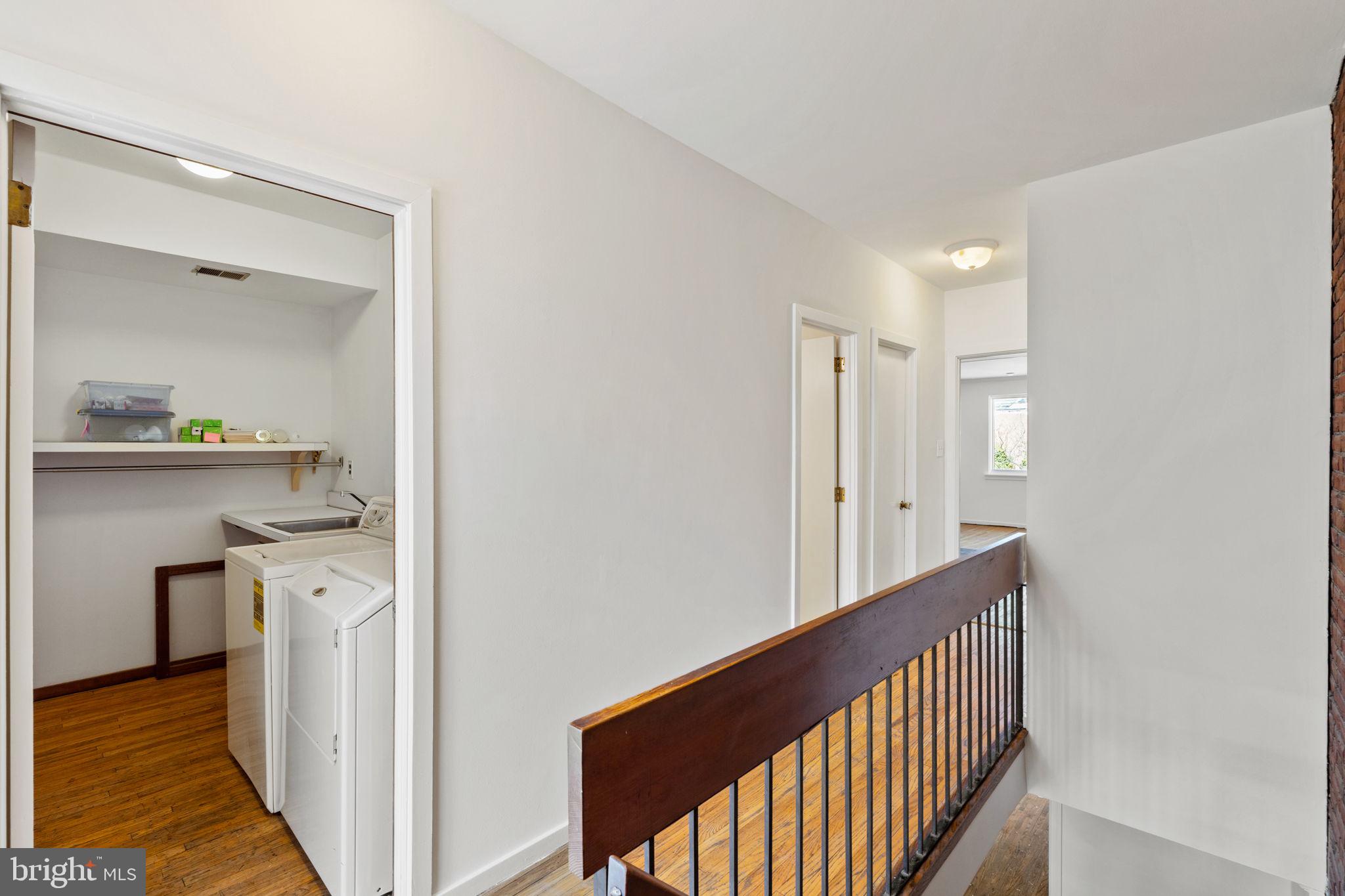 233 Monroe Street Philadelphia, PA 19147 - Photo 36 of 51 a view of a hallway with washer and dryer