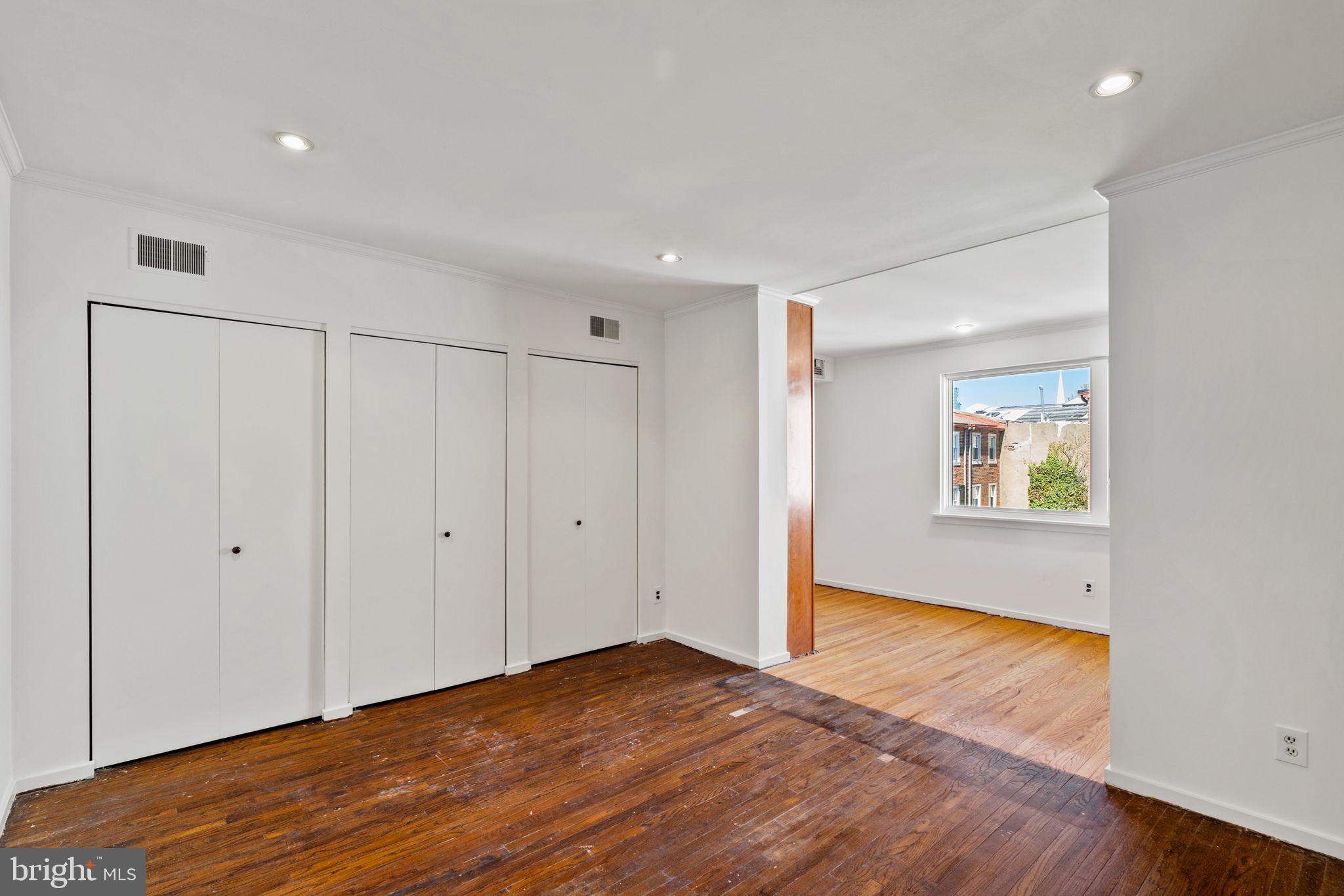 233 Monroe Street Philadelphia, PA 19147 - Photo 40 of 51 a view of an empty room with wooden floor