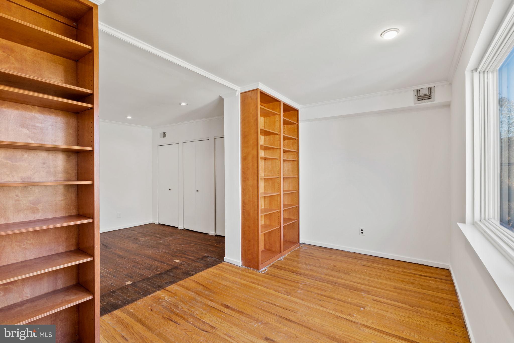 233 Monroe Street Philadelphia, PA 19147 - Photo 41 of 51 a view of empty room with wooden floor and cabinet