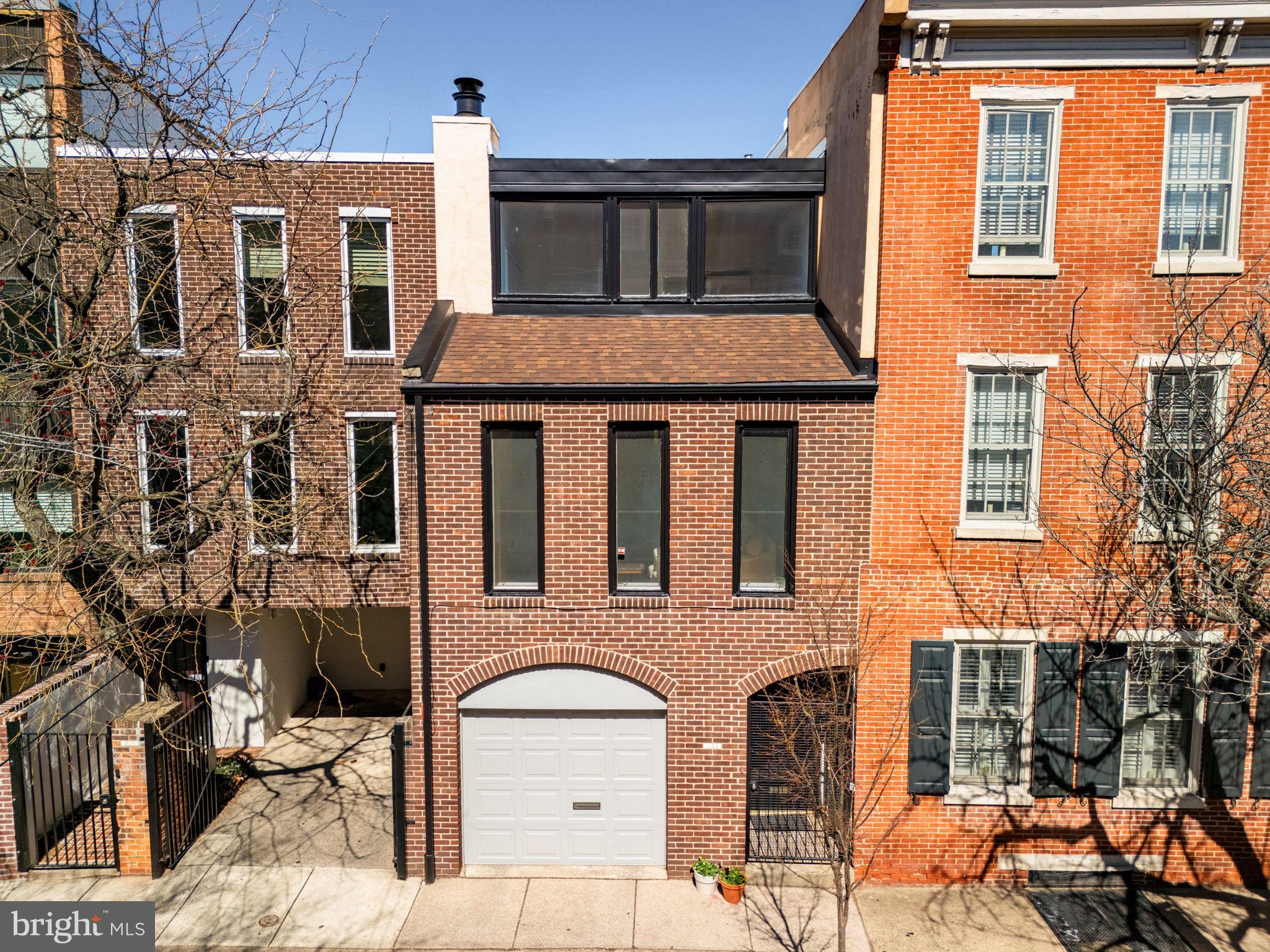 233 Monroe Street Philadelphia, PA 19147 - Photo 44 of 51 a front view of a house with a outdoor space