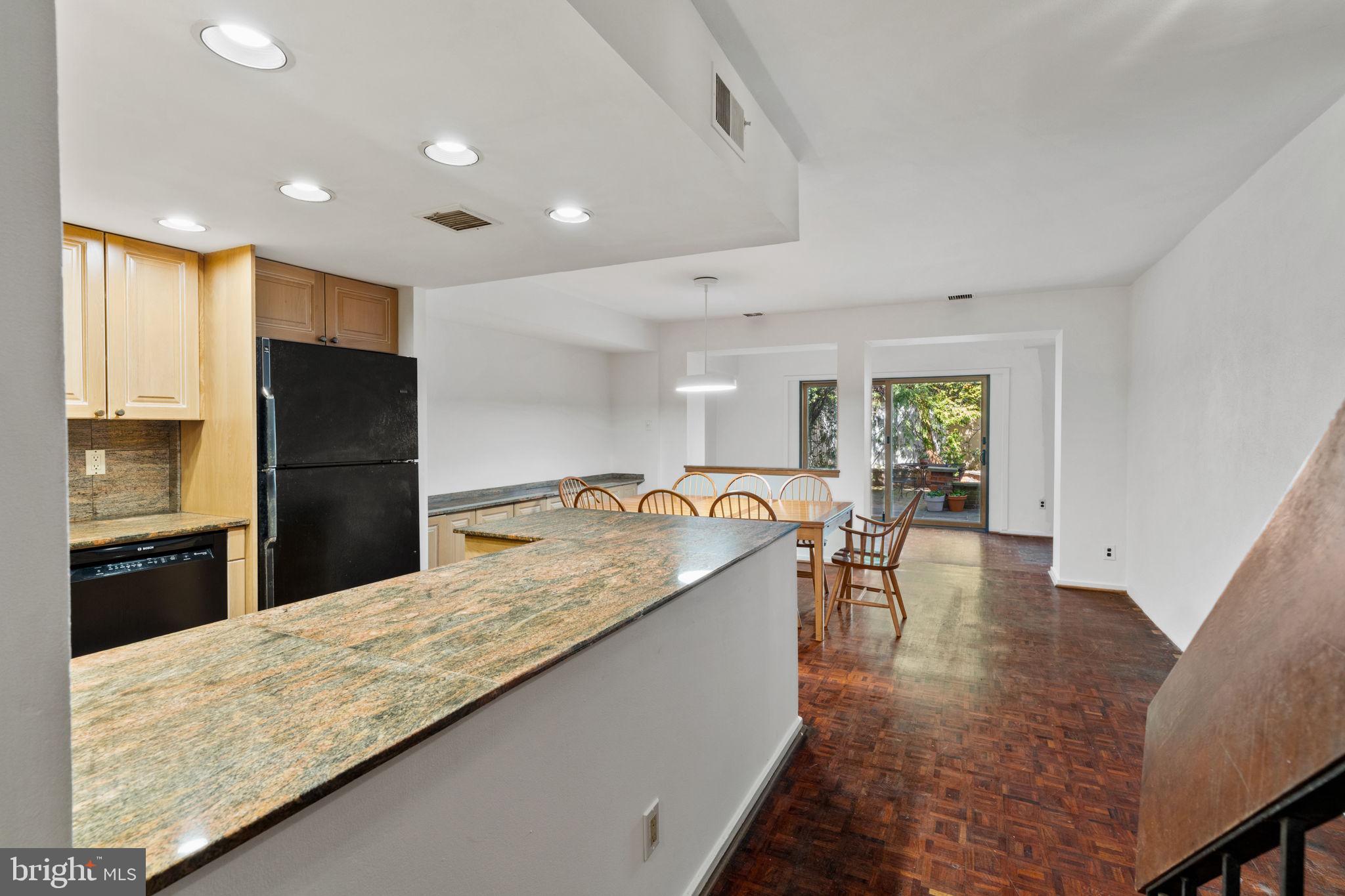 233 Monroe Street Philadelphia, PA 19147 - Photo 6 of 51 a large kitchen with kitchen island a sink stainless steel appliances and cabinets