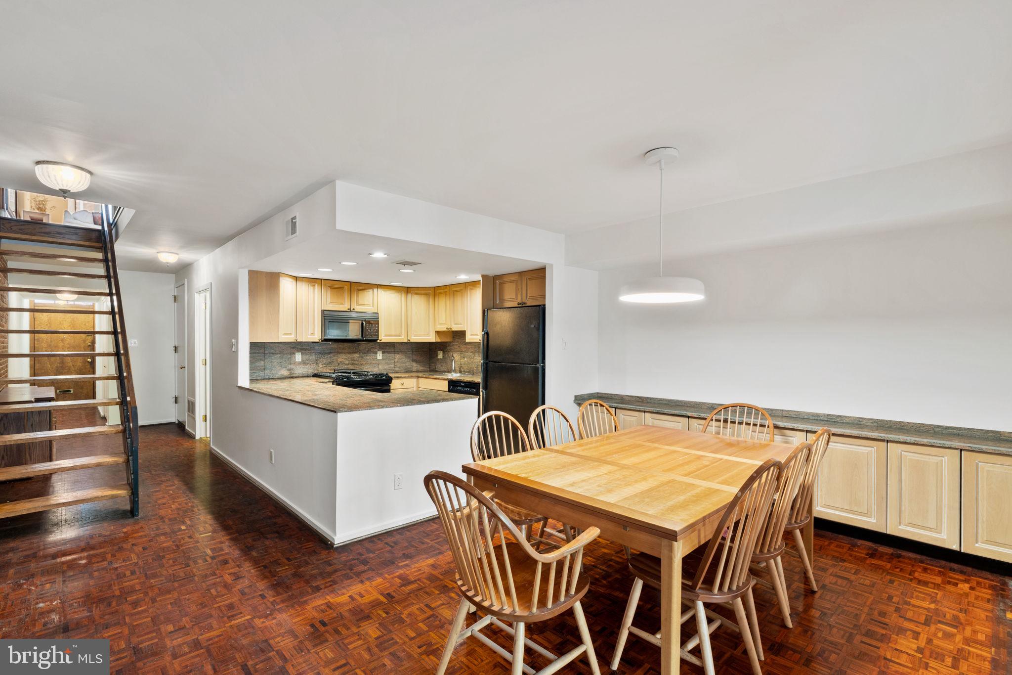 233 Monroe Street Philadelphia, PA 19147 - Photo 7 of 51 a kitchen with a table and chairs in it