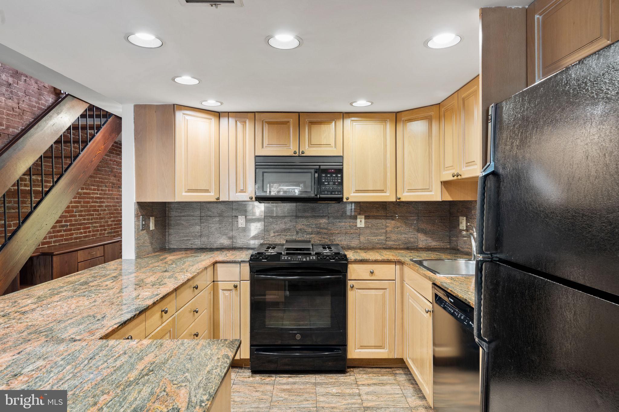 233 Monroe Street Philadelphia, PA 19147 - Photo 10 of 51 a kitchen with a sink stove and refrigerator