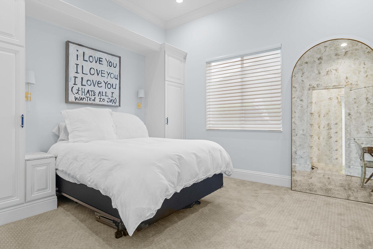 750 Northeast 37th Street Boca Raton, FL 33431 - Photo 21 of 50 a large bed sitting in a bedroom next to a window