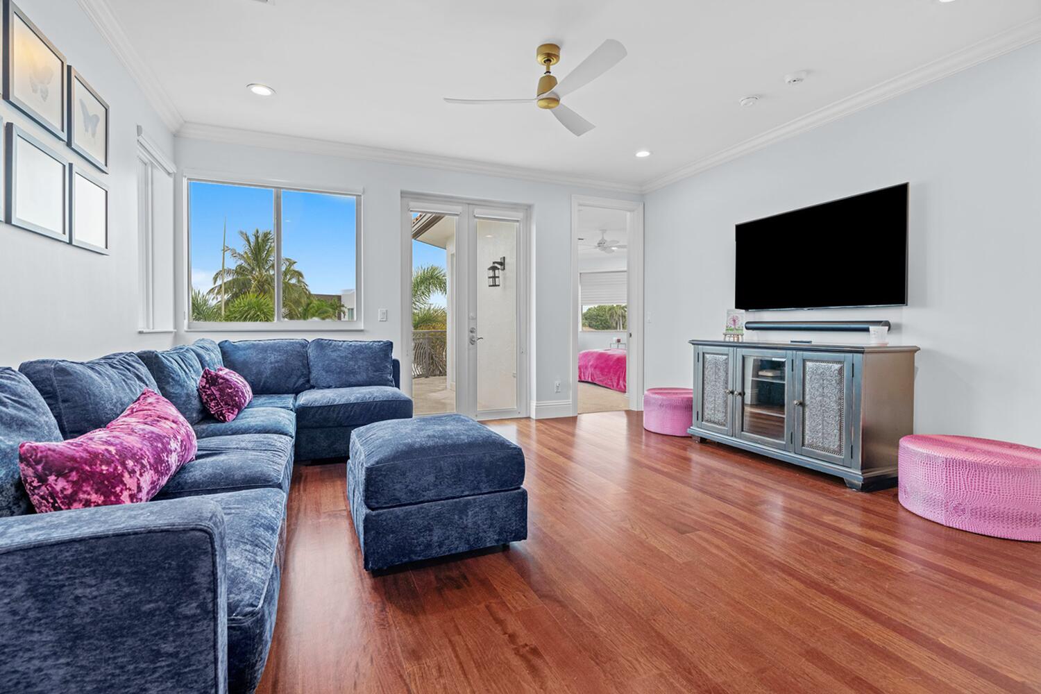 750 Northeast 37th Street Boca Raton, FL 33431 - Photo 29 of 50 a living room with furniture and a flat screen tv