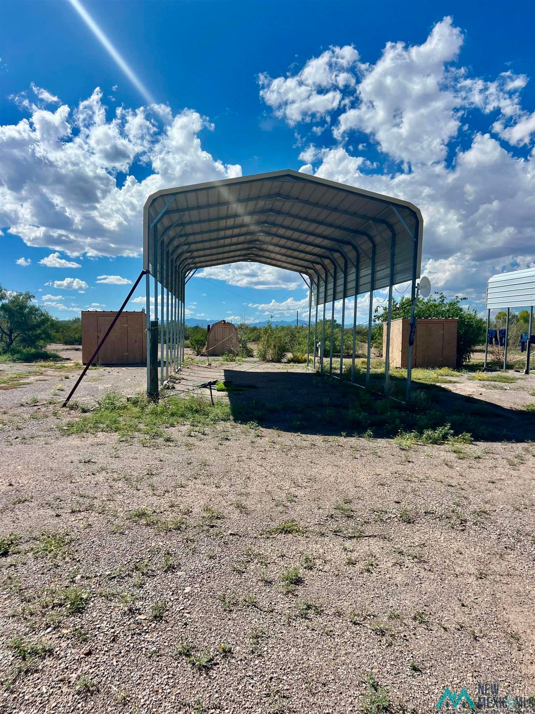 21 Appaloosa Road Caballo, NM 87931 - Photo 8 of 17 View of parking with a detached carport