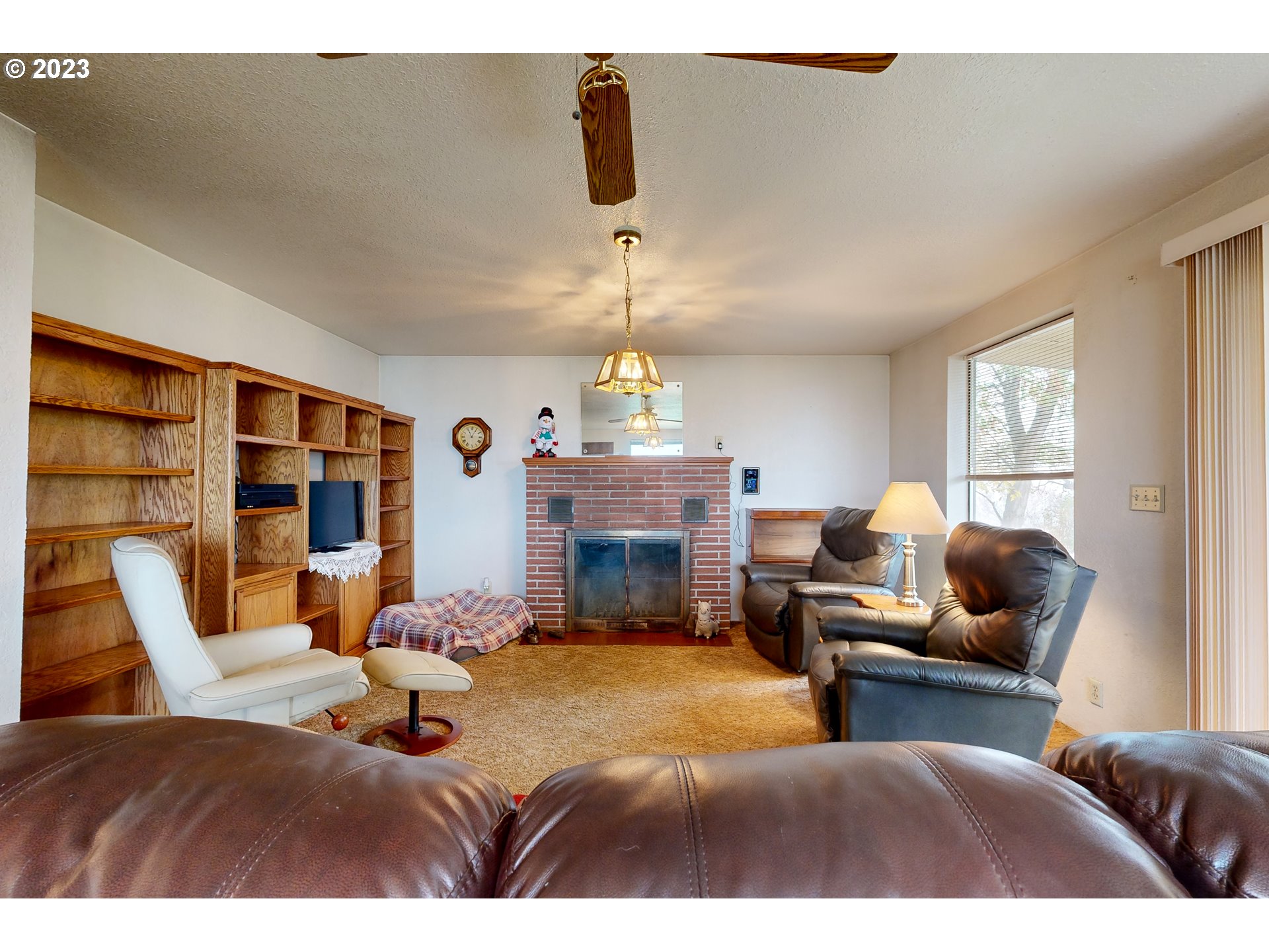 55478 Stateline Road Milton Freewater, OR 97862 - Photo 8 of 26 a bedroom with furniture and a fireplace