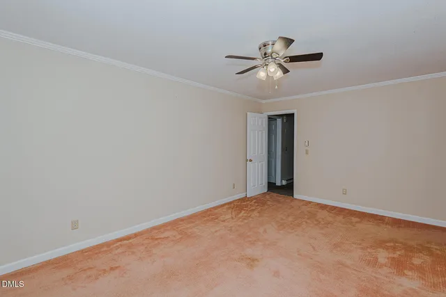 a view of a room with a ceiling fan