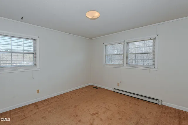 an empty room with a fan