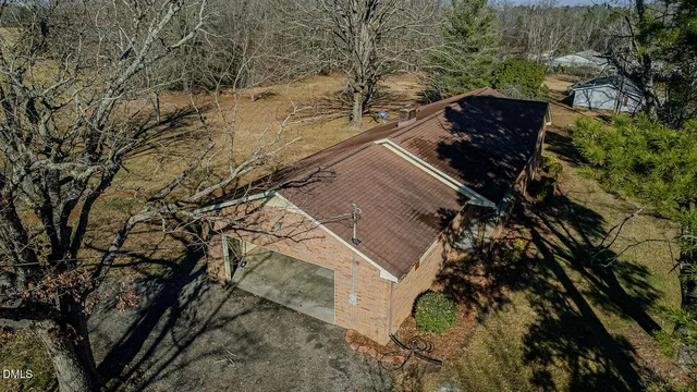 a view of a yard with a tree