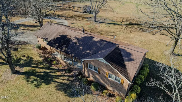 an aerial view of a house with swimming pool