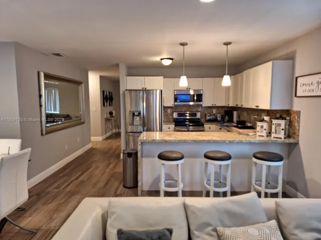 a bathroom with a toilet a sink and a mirror