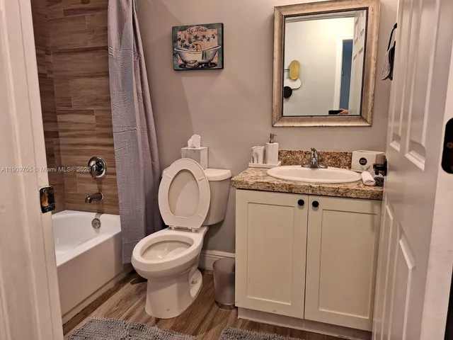 a bedroom with two beds and a window