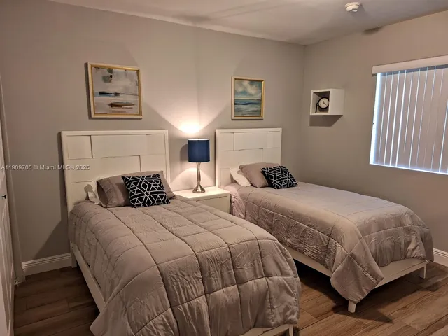 a bathroom with a granite countertop shower toilet and sink