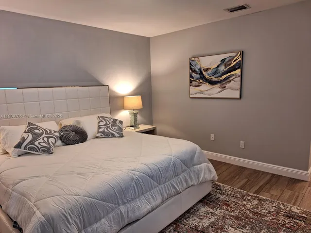a view of bathroom with a mirror