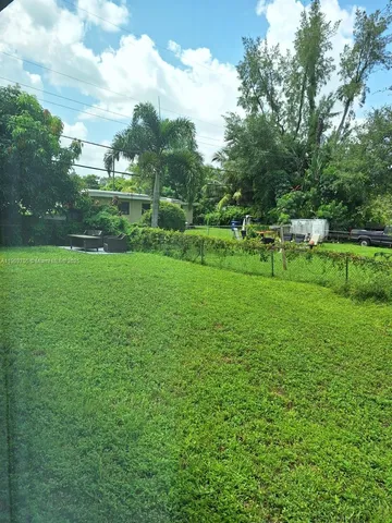 a stove top oven sitting inside of a kitchen