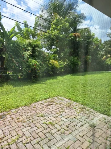 a view of a garden with a bench