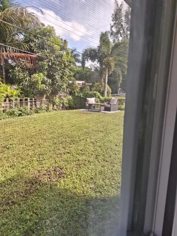 a bedroom with two beds and a night stand