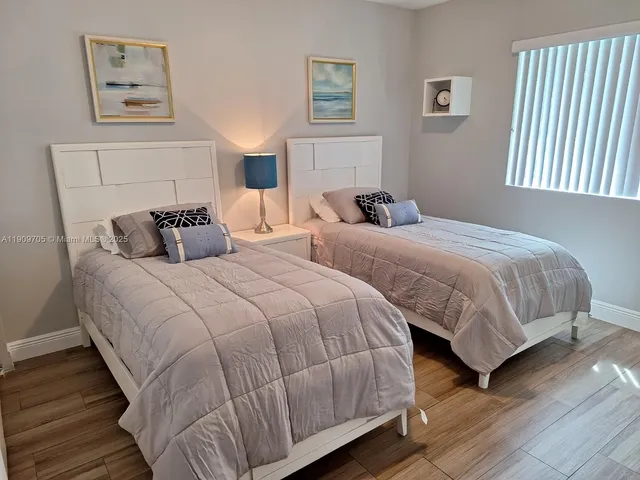 a bedroom with a bed and a table