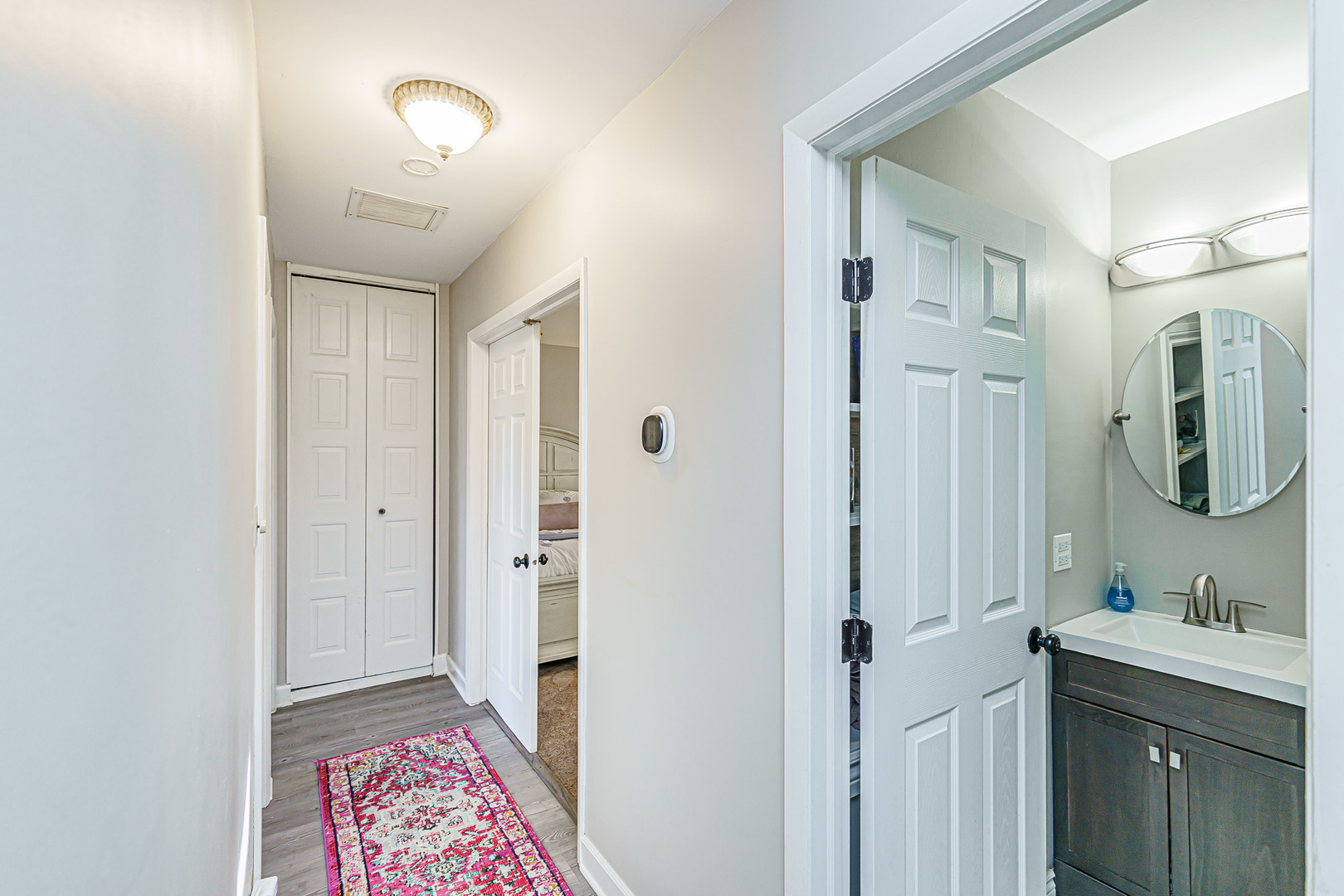 170 Old Mill Grove Road Lake Zurich, IL 60047 - Photo 12 of 23 a bathroom with a sink and a mirror