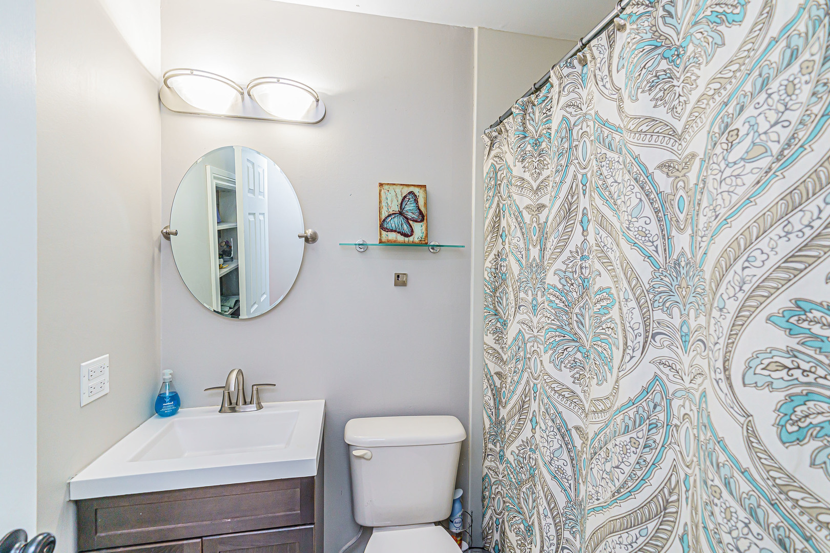 170 Old Mill Grove Road Lake Zurich, IL 60047 - Photo 18 of 23 a bathroom with a toilet sink and mirror