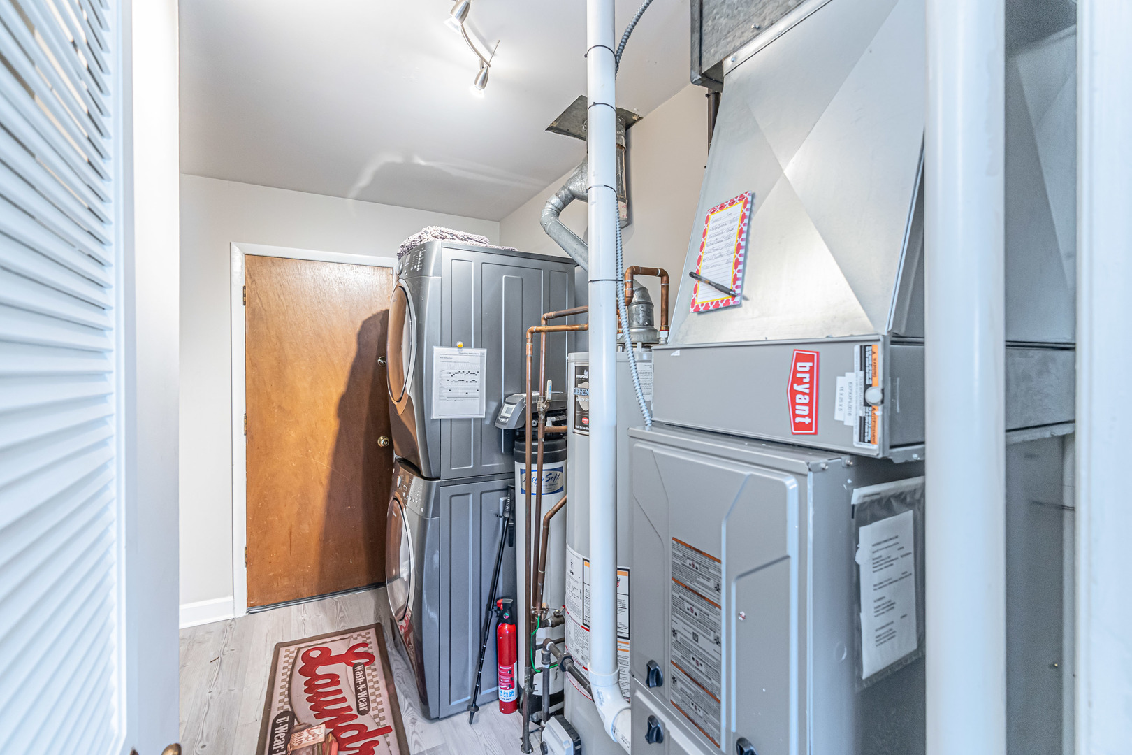170 Old Mill Grove Road Lake Zurich, IL 60047 - Photo 20 of 23 a view of walk in closet with clothes and shoes