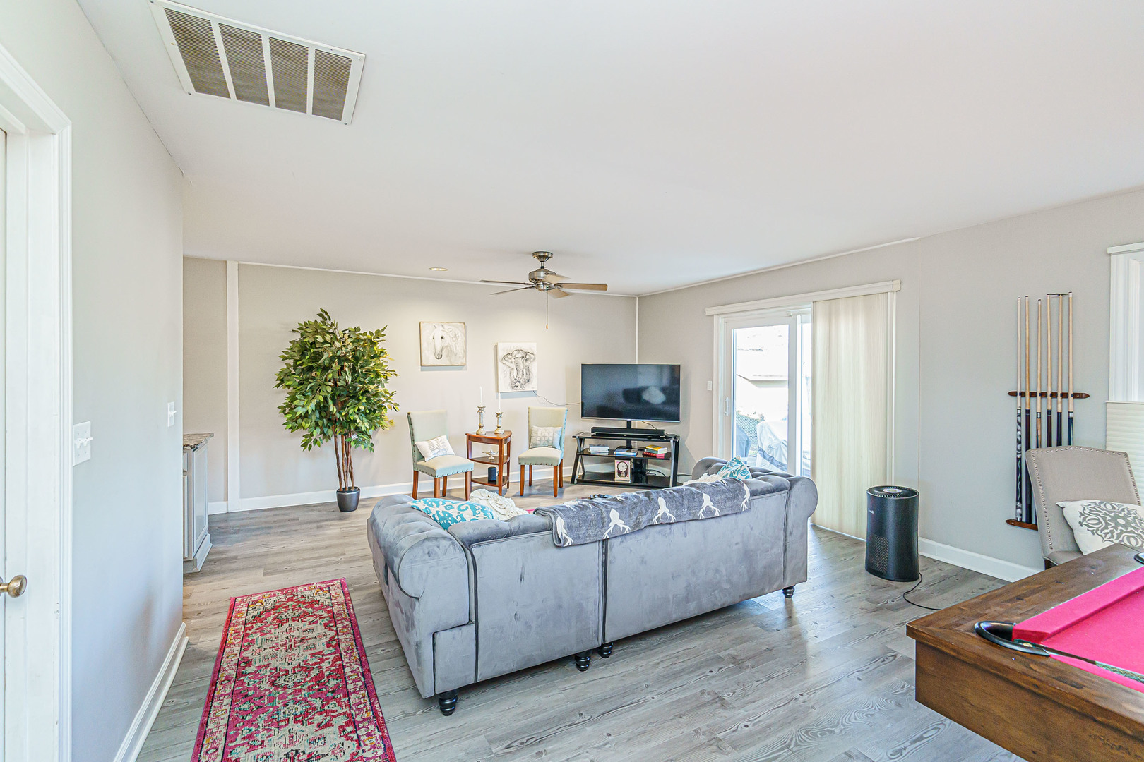 170 Old Mill Grove Road Lake Zurich, IL 60047 - Photo 5 of 23 a living room with furniture and a flat screen tv