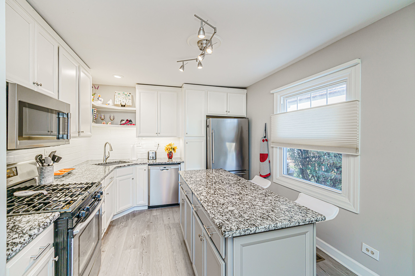 170 Old Mill Grove Road Lake Zurich, IL 60047 - Photo 10 of 23 a kitchen with stainless steel appliances granite countertop a sink stove and refrigerator