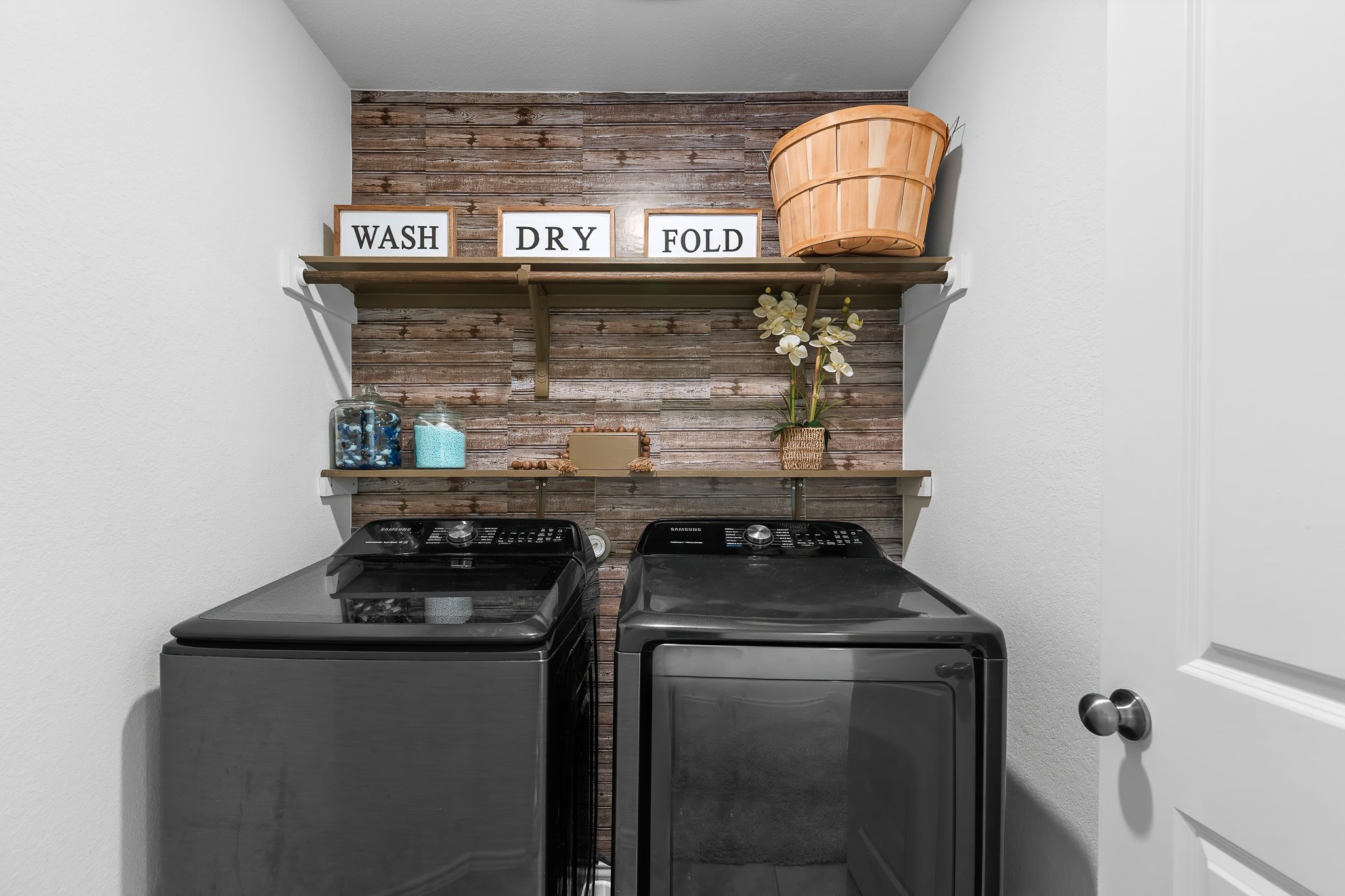 576 Greatest Gift Way Jarrell, TX 76537 - Photo 19 of 37 A dedicated laundry space offers convenient utility with integrated shelving.