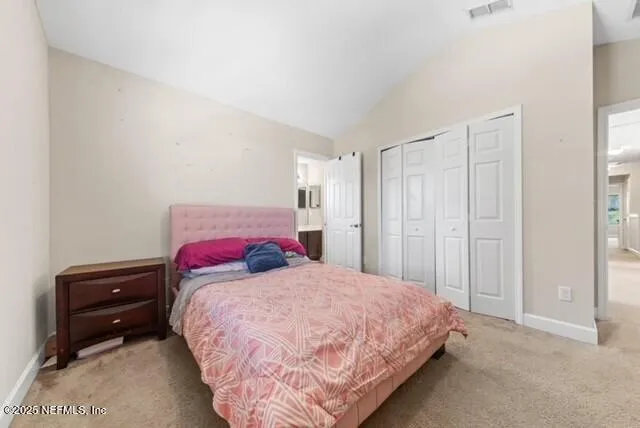 a bedroom with a bed and a closet