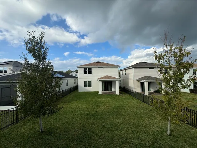 a view of house with yard and entertaining space