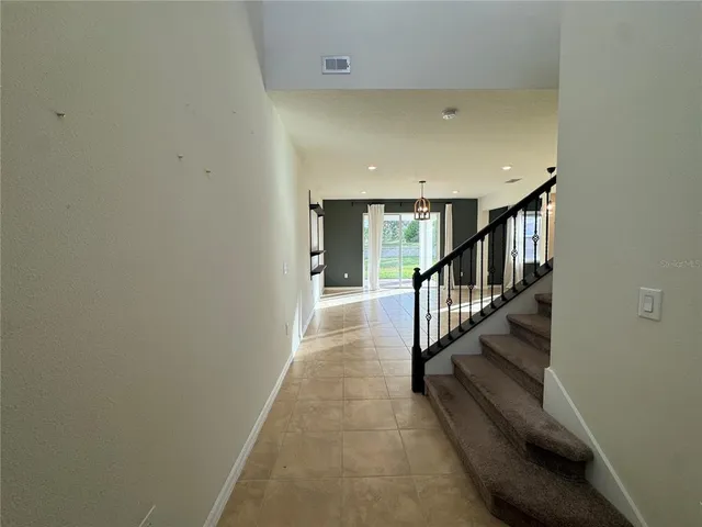 a view of a hallway with staircase