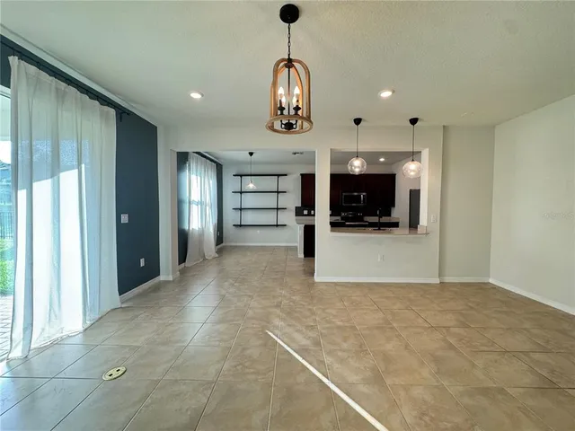 a view of a hallway with a kitchen