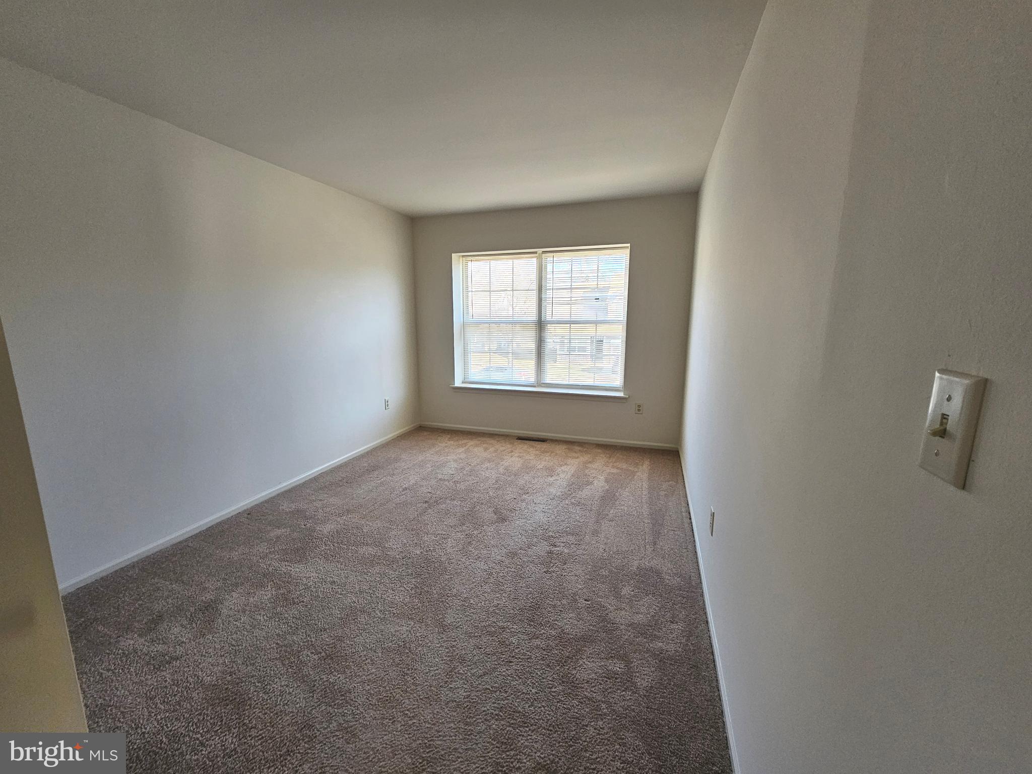 38 Heatherfield Way Dover, DE 19904 - Photo 25 of 26 wooden floor in an empty room with a window