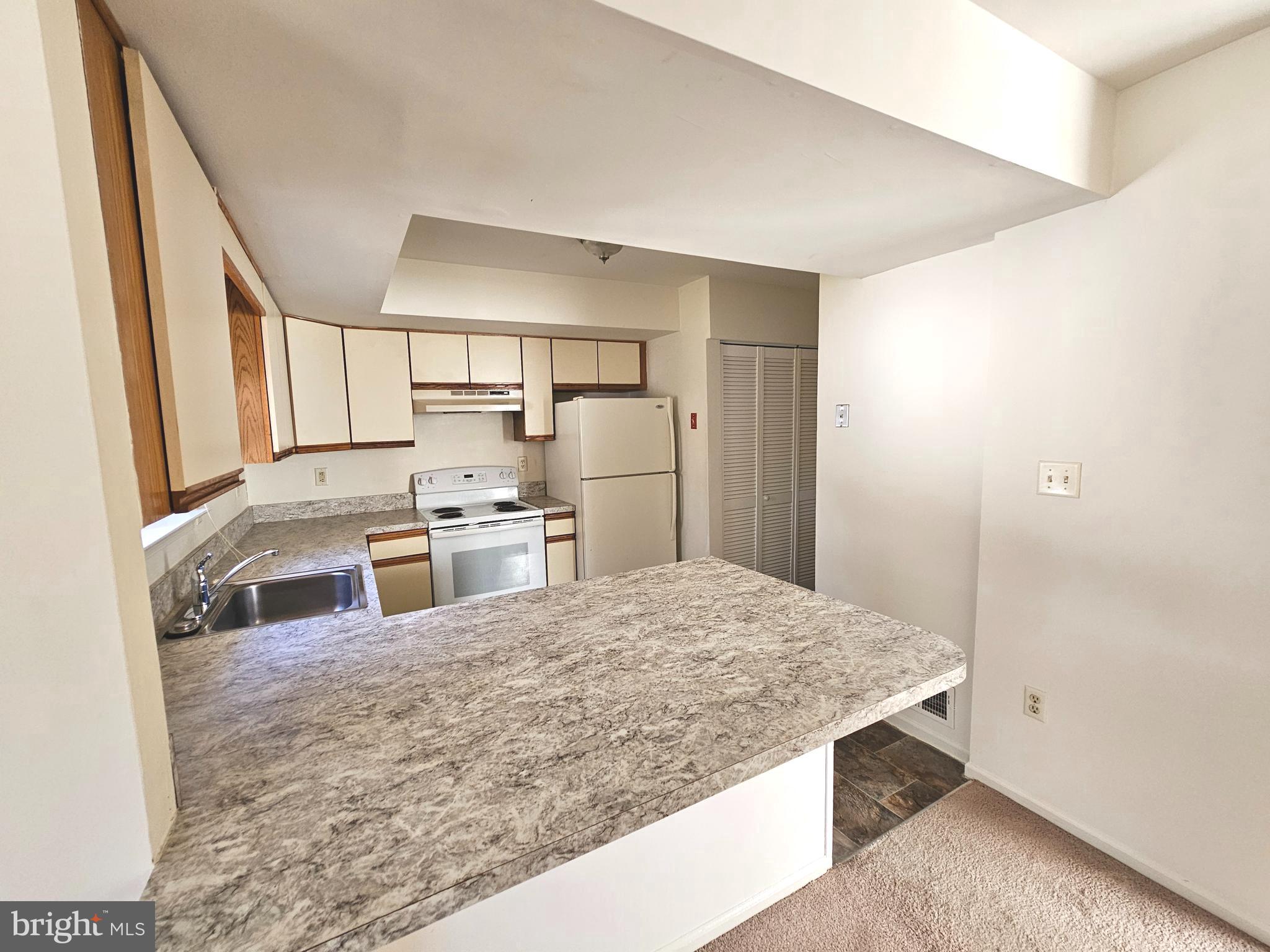 38 Heatherfield Way Dover, DE 19904 - Photo 7 of 26 a kitchen with stainless steel appliances granite countertop a sink refrigerator and cabinets