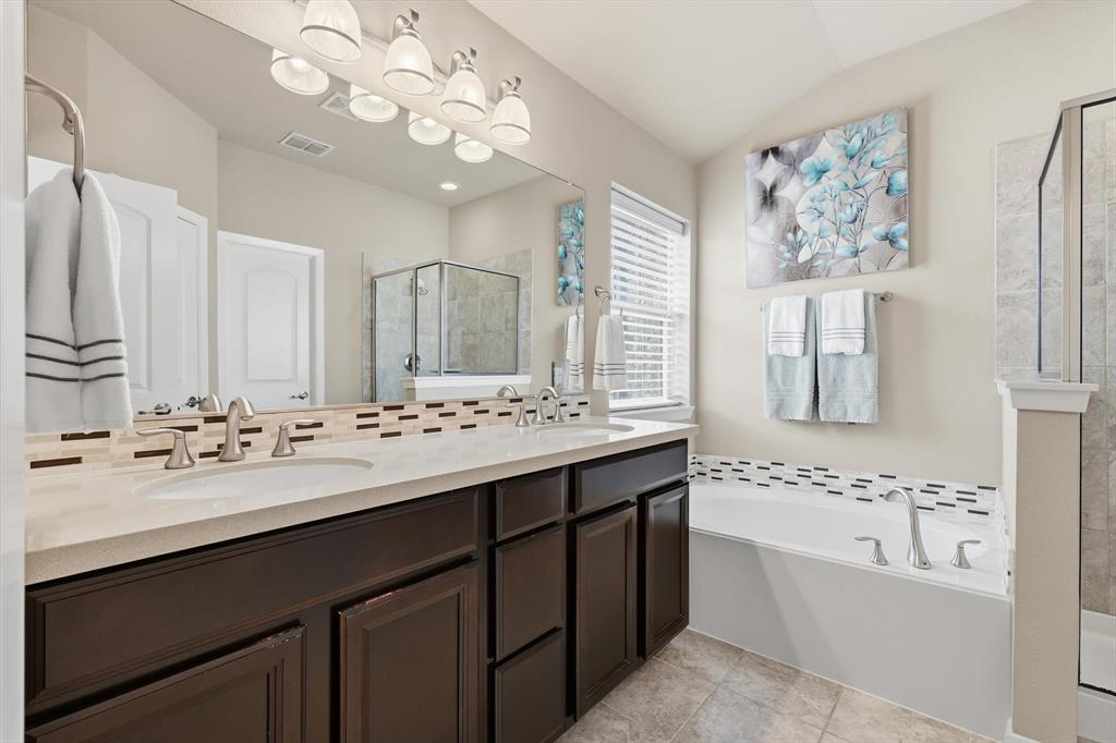 3941 Asbury Lane Addison, TX 75001 - Photo 21 of 30 a bathroom with a double vanity sink mirror and bathtub