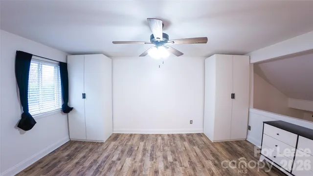 a view of an empty room with a bathroom