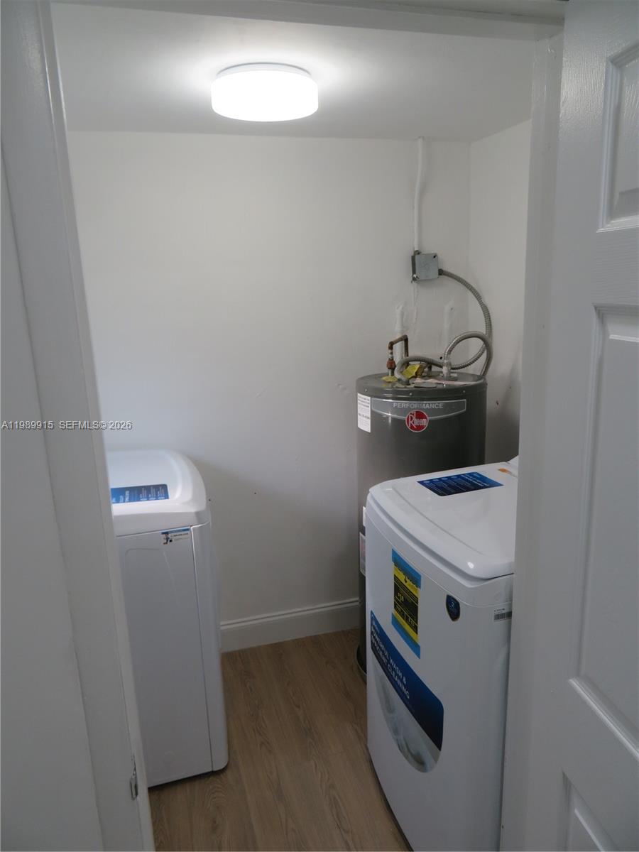 17247 Southwest 112th Place, Unit 21044 Miami, FL 33157 - Photo 21 of 21 a utility room with dryer and washer